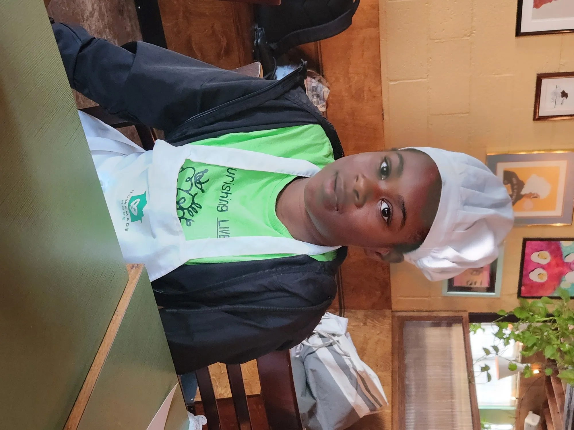Young person in a chef’s hat and apron